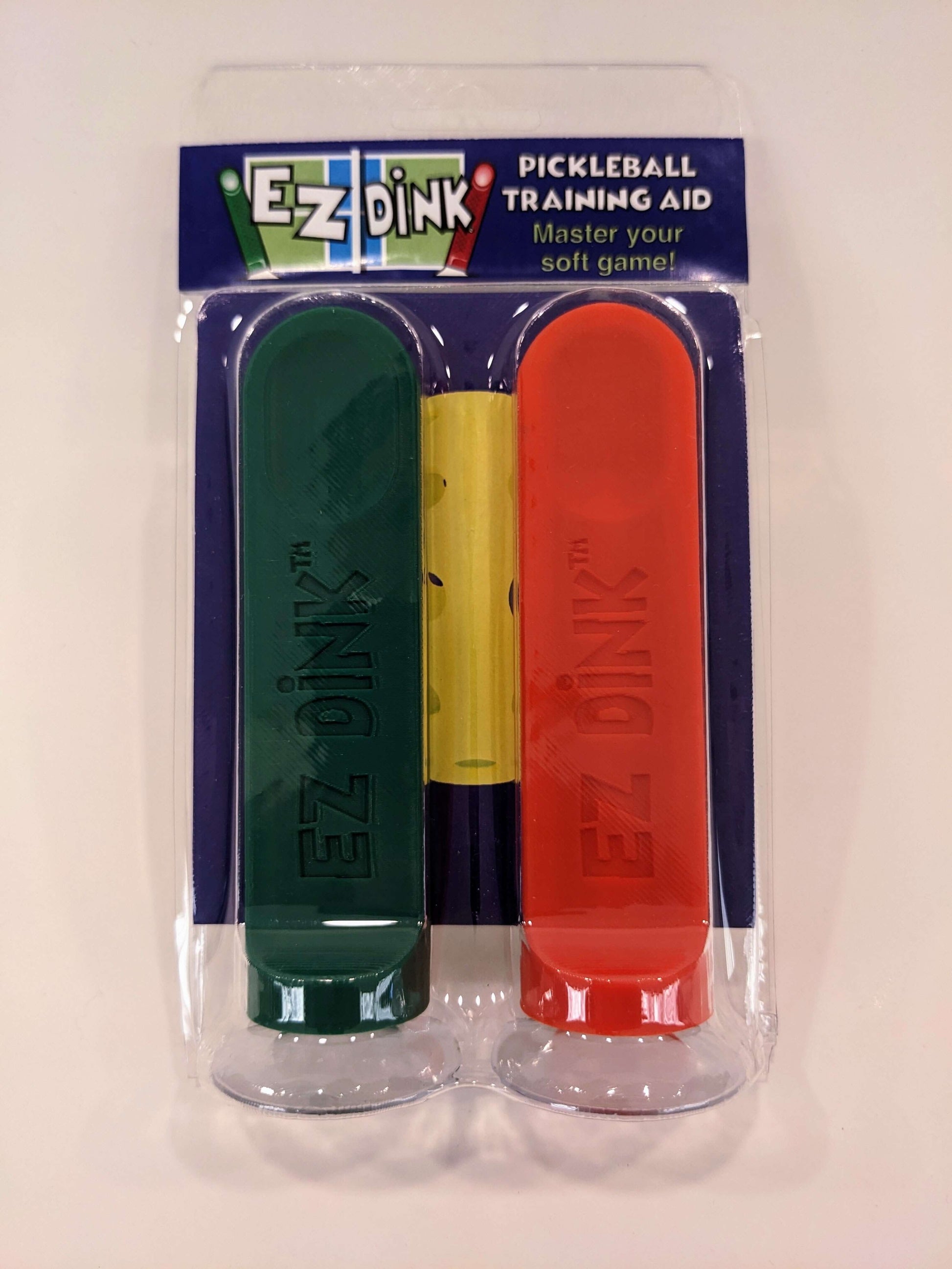 A twin pack of EZ Dink pickleball dinking training aid in green and red