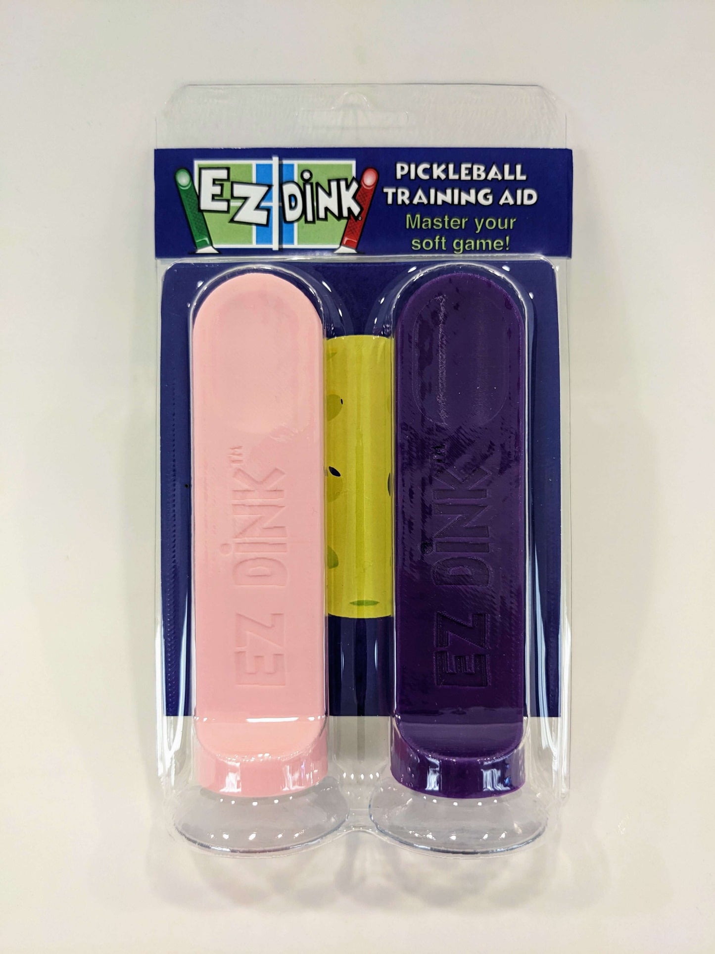 A twin pack of EZ Dink pickleball dinking training aid in purple and pink